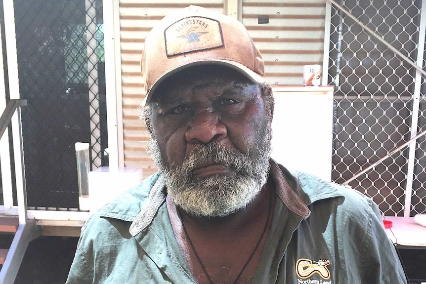 Gudanji man Casey Davey, one of the native title holders seeking compensation, stands outside.
