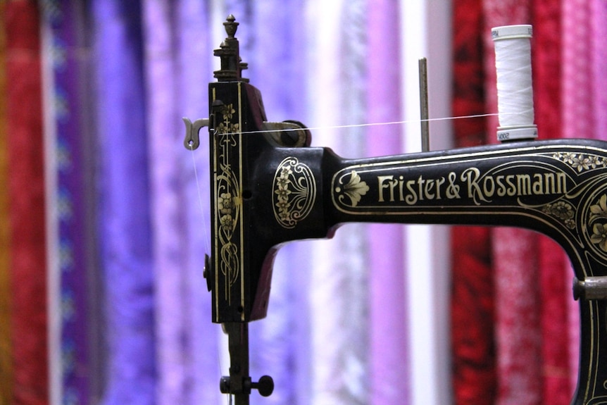 Close up of a vintage hand wound Frister and Rossman sewing machine.