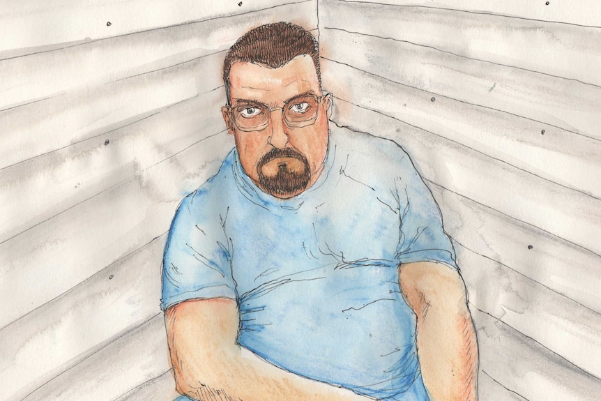 A man with a goatie wearing glasses in a blue T-shirt in a drawing