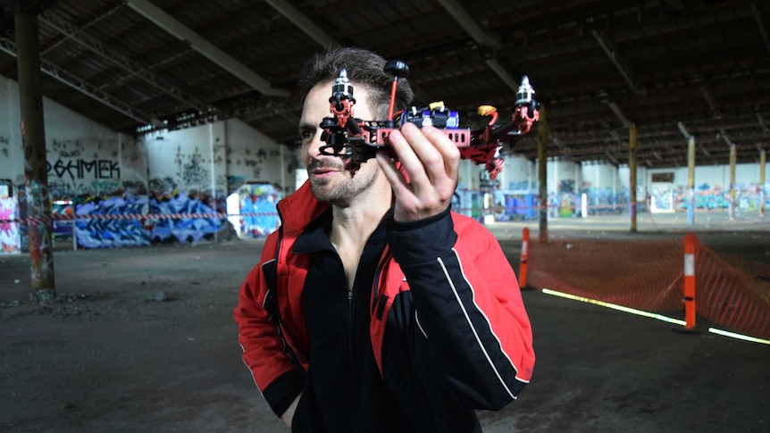 Man holds up his drone