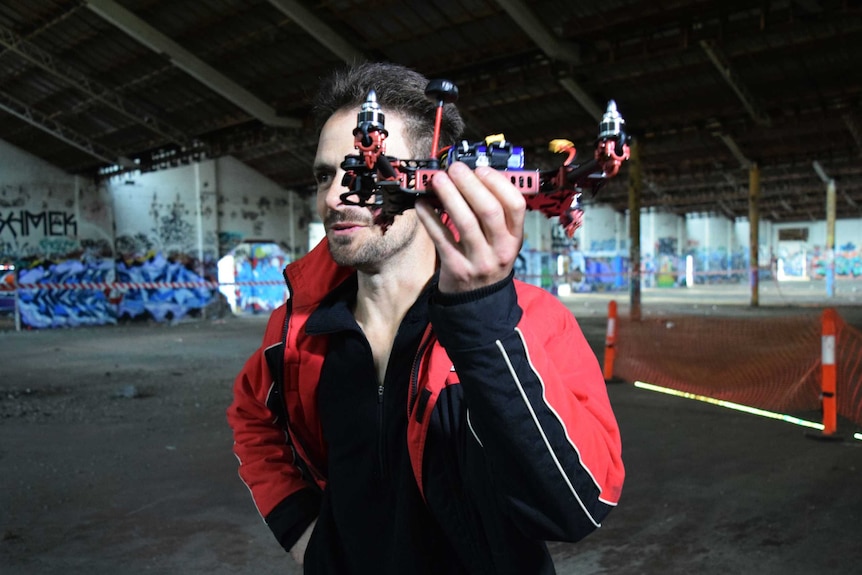 Man holds up his drone