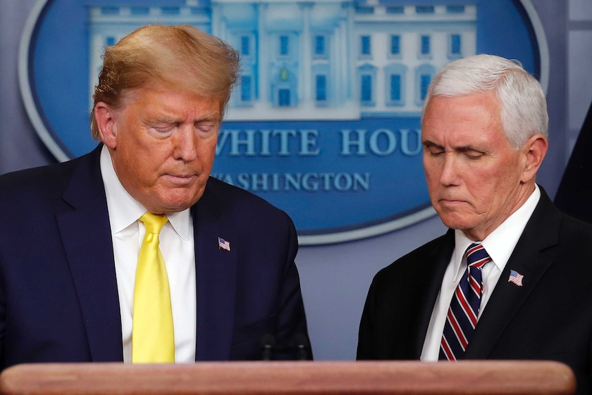 Donald Trump and Mike Pence behind a podium