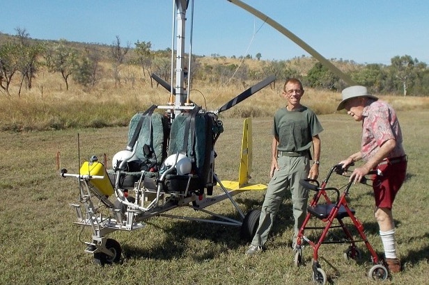 David Goodall leans on his walker as he stands next to the gyrocopter which flew him to a remote Kimberley station.