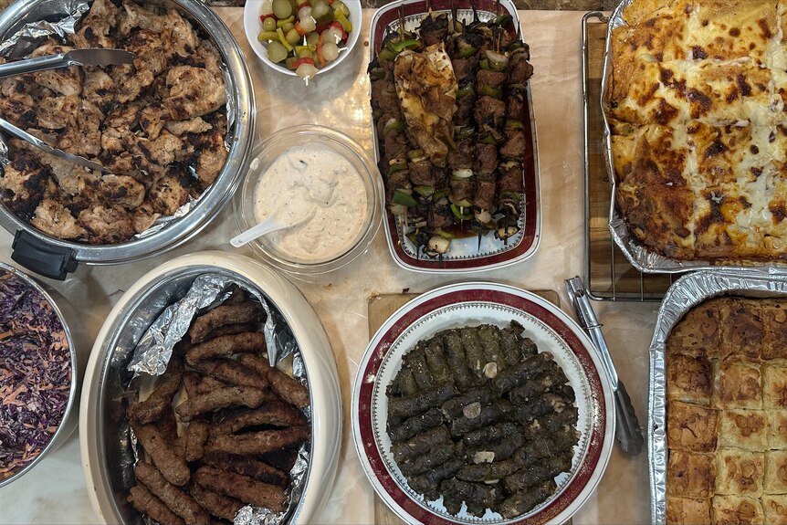 An assortment of plates and dishes on a table containing traditional Coptic Orthodox foods.