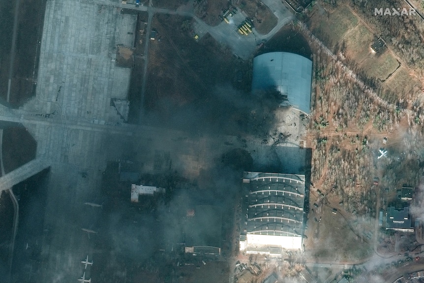 Satellite image showing damage to buildings at an airport in Ukraine.