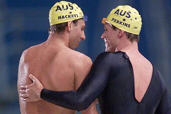 Kieren Perkins and Grant Hackett embrace after the 1500m final in Sydney. (Getty: Hamish Blair)