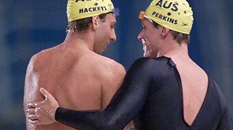 Kieren Perkins and Grant Hackett embrace after the 1500m final in Sydney. (Getty: Hamish Blair)