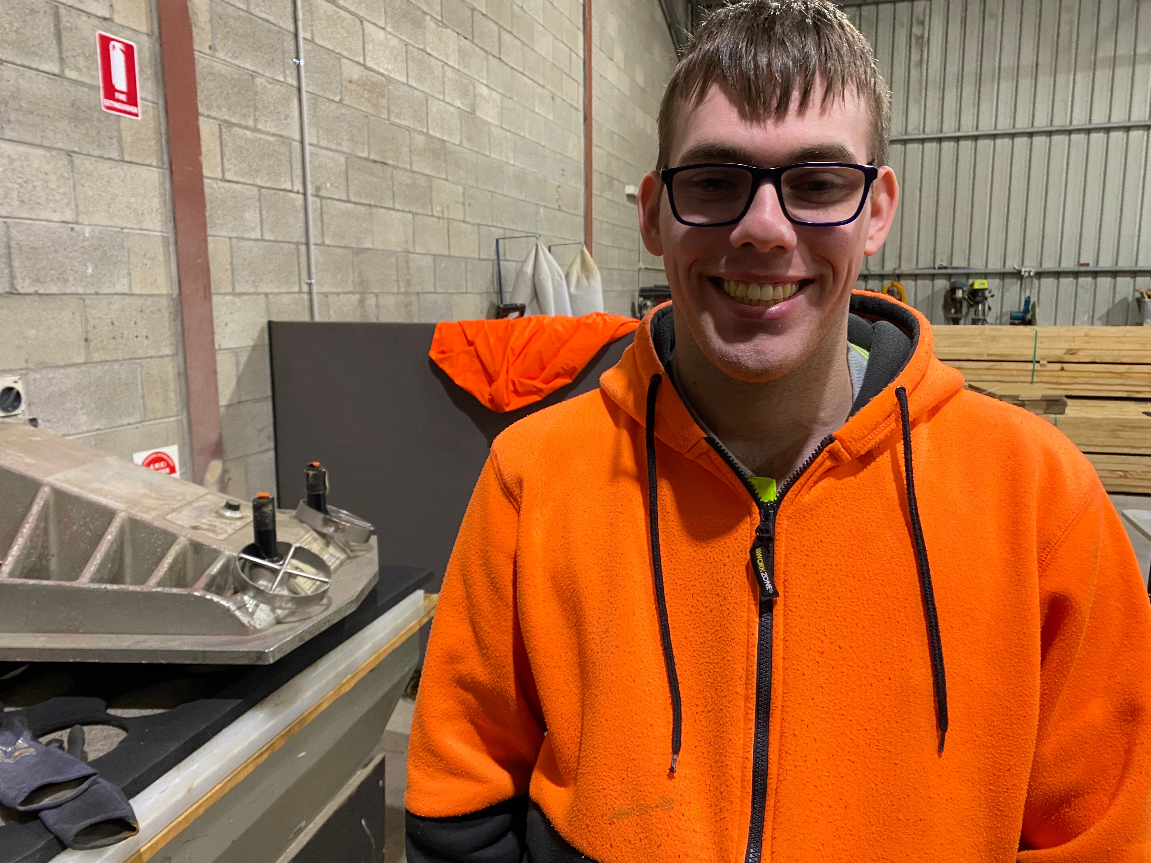 A man in a hi-vis work jumper.