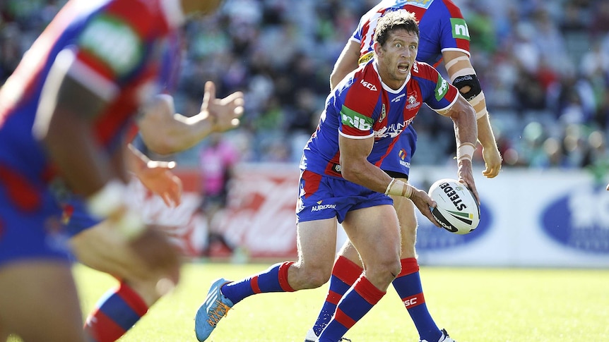 Newcastle's Kurt Gidley passes the ball against the Raiders in Canberra on April 12, 2014