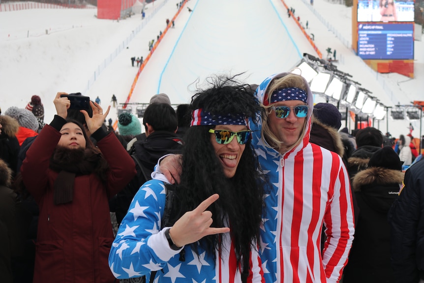 American supporters of Shaun White wearing the colours of the US flag at the men's snowboard halfpipe final.