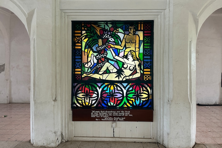 A stained glass window shows the story of Adam and Eve at EFKS church in Fasito'o-Uta.
