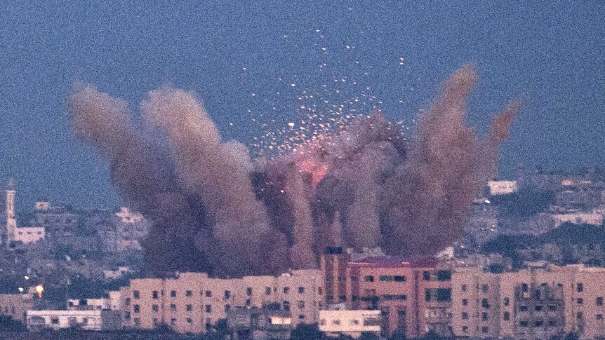 A picture taken from the southern Israeli town of Sderot shows smoke billowing from a spot targeted by an Israeli air strike.