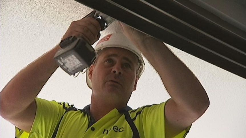 Man drilling on a Canberra construction site (identifiable). Good generic. Taken February 13, 2013.