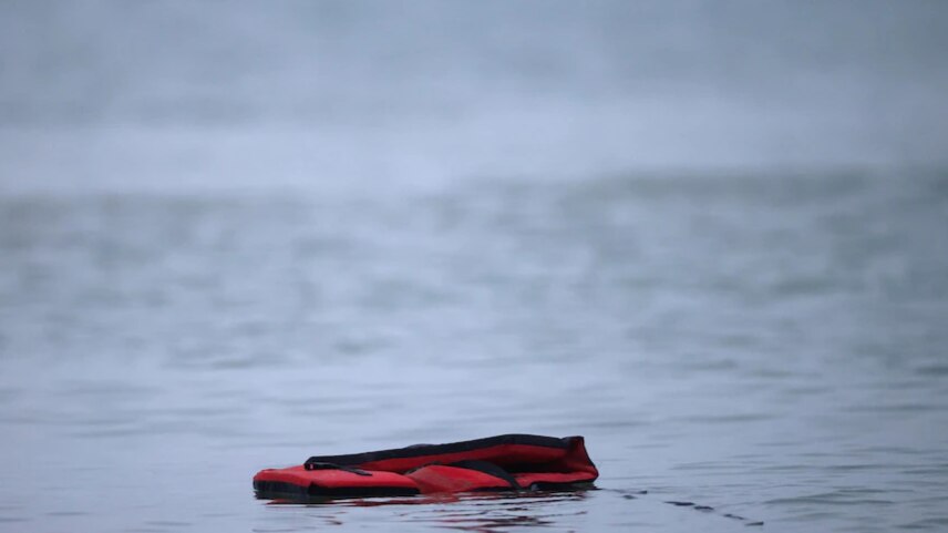 An empty life vest floats in the water