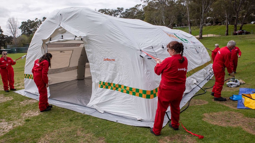 SAVEM staff set up the inflatable veterinary hospital