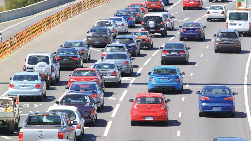 Cars in traffic on a road.