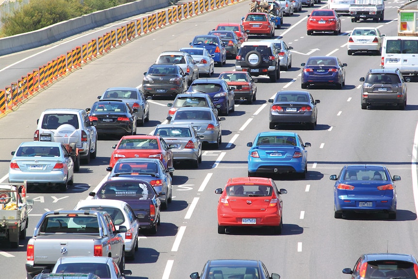 Cars in traffic on a road.