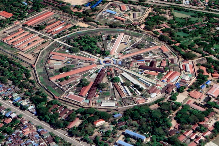 An aerial view of a round building, like a pie chart. 
