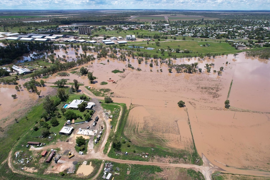 Brown floodwater pools across floodplains.