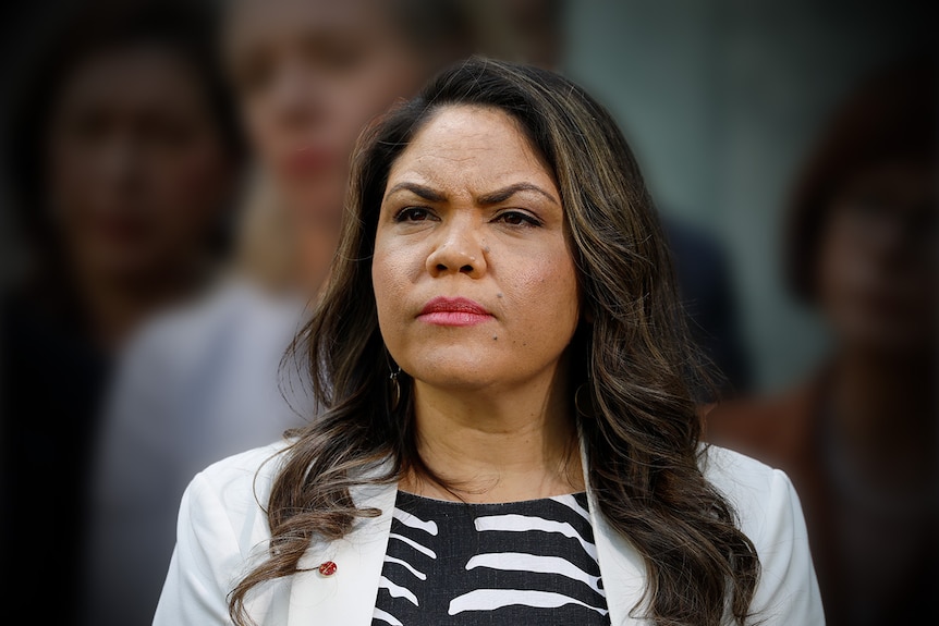 An Aboriginal woman with a stern facial expression