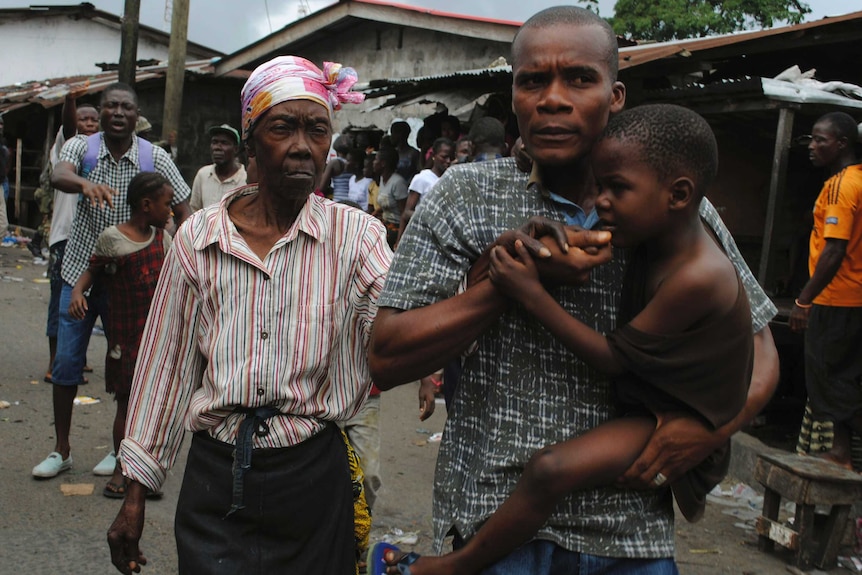 Residents of a neighbourhood placed under Ebola quarantine in Liberia