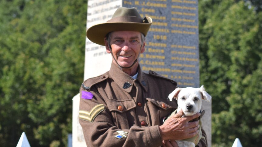 Former Australian Army Signalman Dale Henderson, with Horrie the dog.