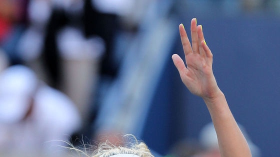 Wozniacki rejoices after defeating Sharapova