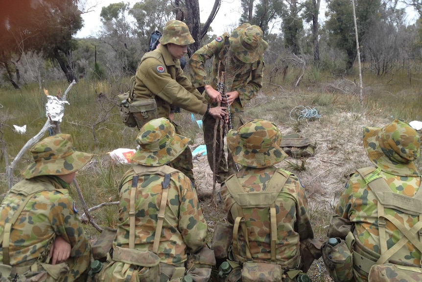 Cadets are given a field craft lesson.