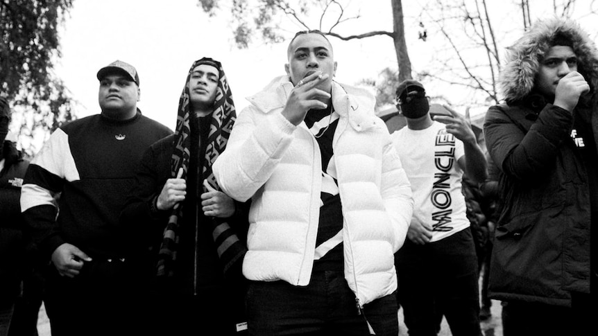 Press shot of rap group ONEFOUR; black and white photo of the group together