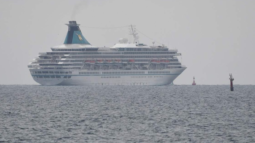 Cruise ship Artania sails towards horizon on calm seas after leaving Fremantle Port