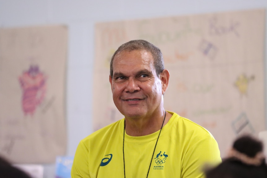 Former Australian Olympian Danny Morseu chatting with a classroom full of kids