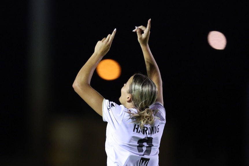 Sophie Harding points to the sky with both index fingers after an A-League Women goal for Western Sydney Wanderers.