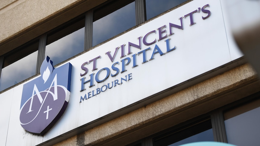 A sign on an exterior wall says St Vincent's Hospital Melbourne
