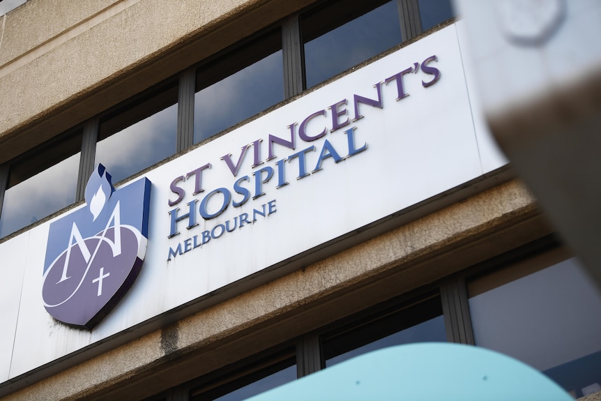 A sign on an exterior wall says St Vincent's Hospital Melbourne