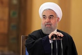 Iranian President Hassan Rouhani prepares to speak during a press conference.