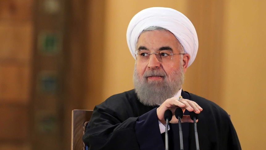 Iranian President Hassan Rouhani prepares to speak during a press conference.