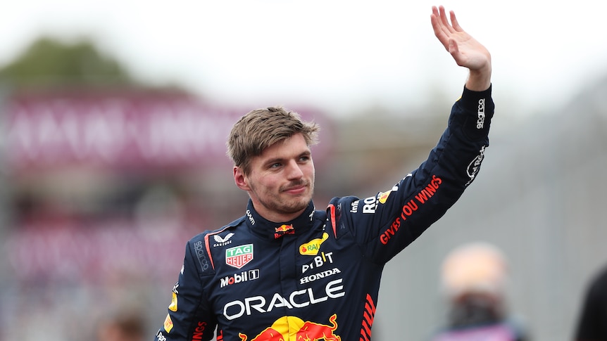 Max Verstappen waves to the crowd with his left hand at the Australian Formula 1 Grand Prix.