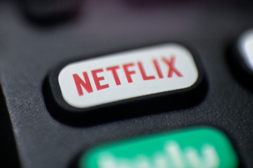 Photo shows a logo for Netflix on a remote control