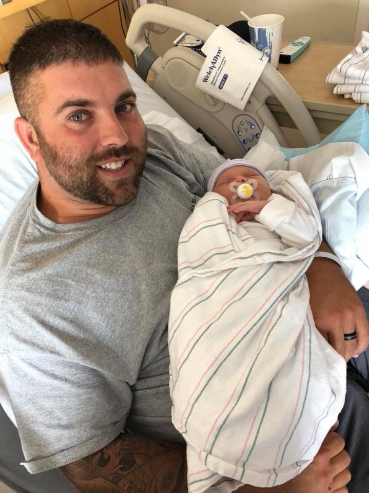 Kevin Quinn with his newborn baby in hospital.