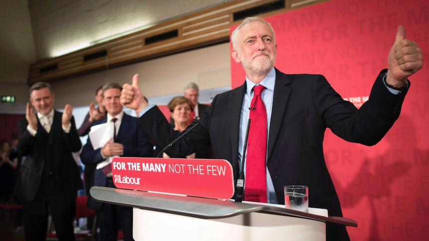 Jeremy Corbyn holds two thumbs up