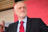Jeremy Corbyn holds two thumbs up