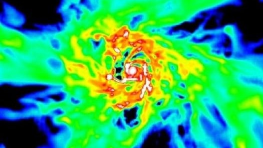 A spiral simulation of strands of  gas coalescing to form an ancient galaxy.