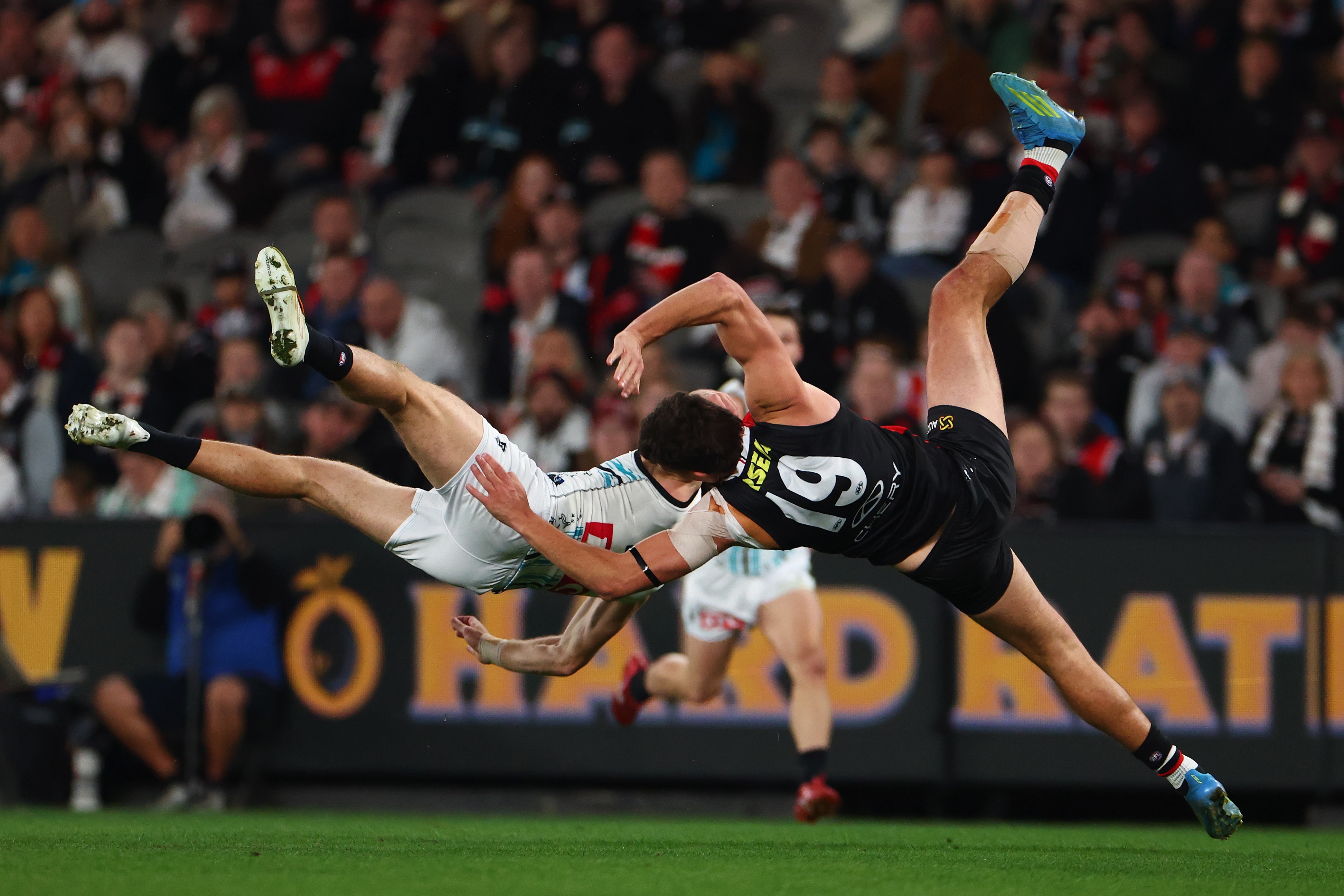 Live: Saints win after Port star taken off following mid-air collision