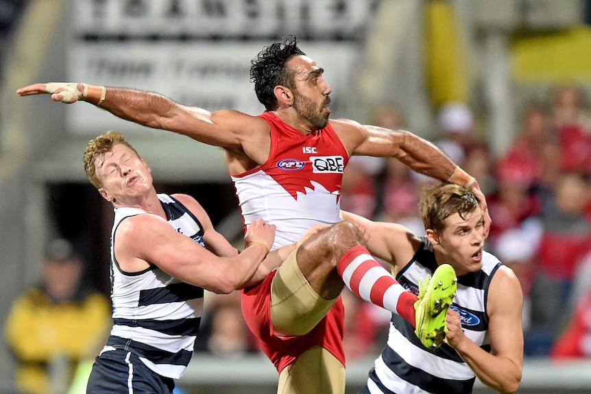 Adam Goodes kicks against the Cats