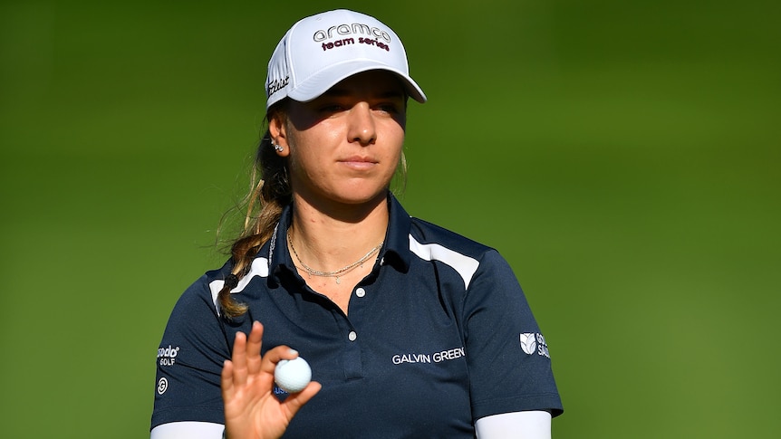 Stephanie Kyriacou holds a ball during the third round of the Evian Championship.