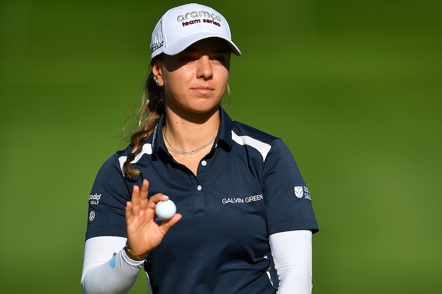Stephanie Kyriacou holds a ball during the third round of the Evian Championship.