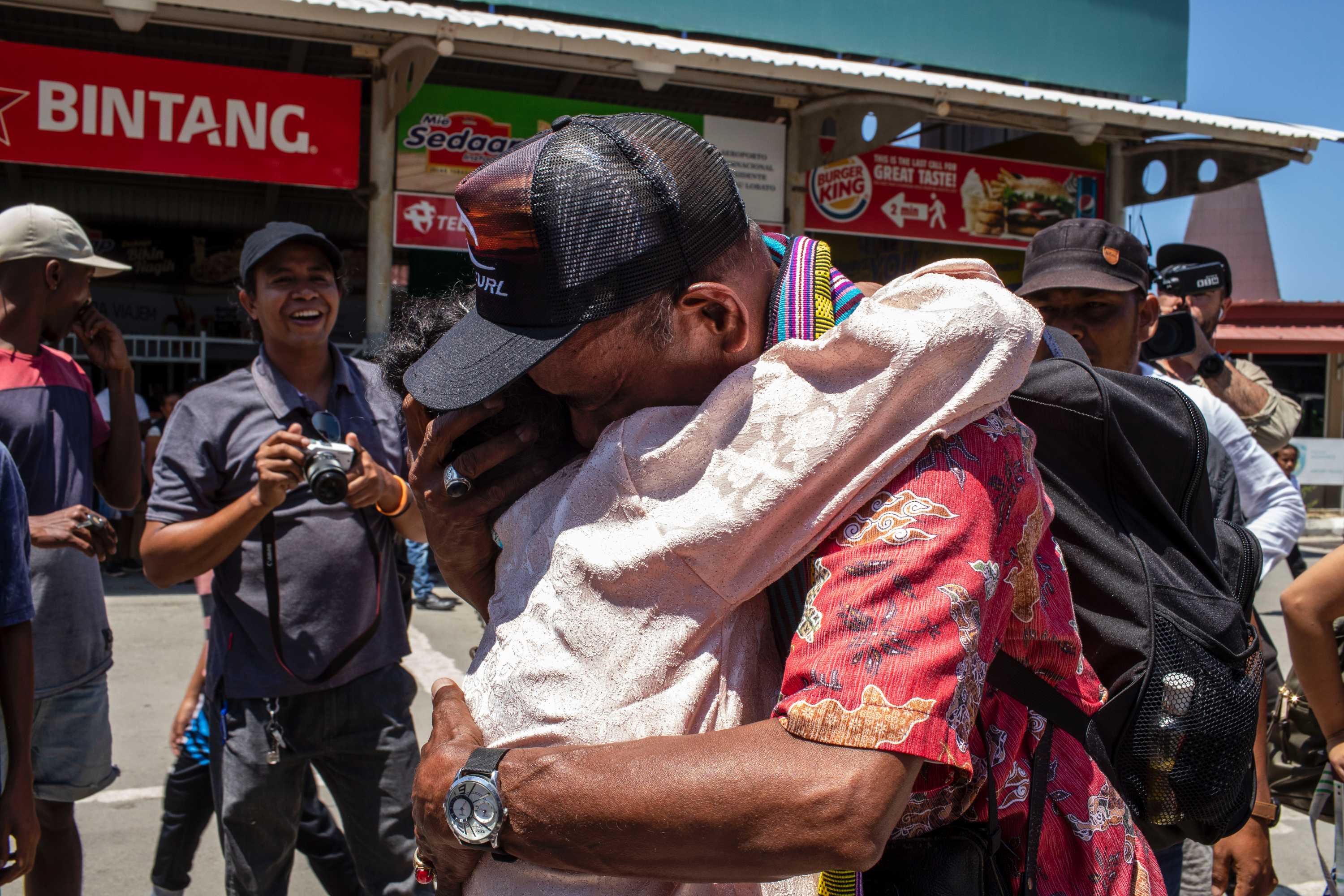 A man hugs his relative.