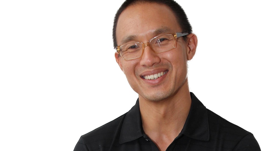 A profile image of a man with black hair, wearing glasses and a black shirt.