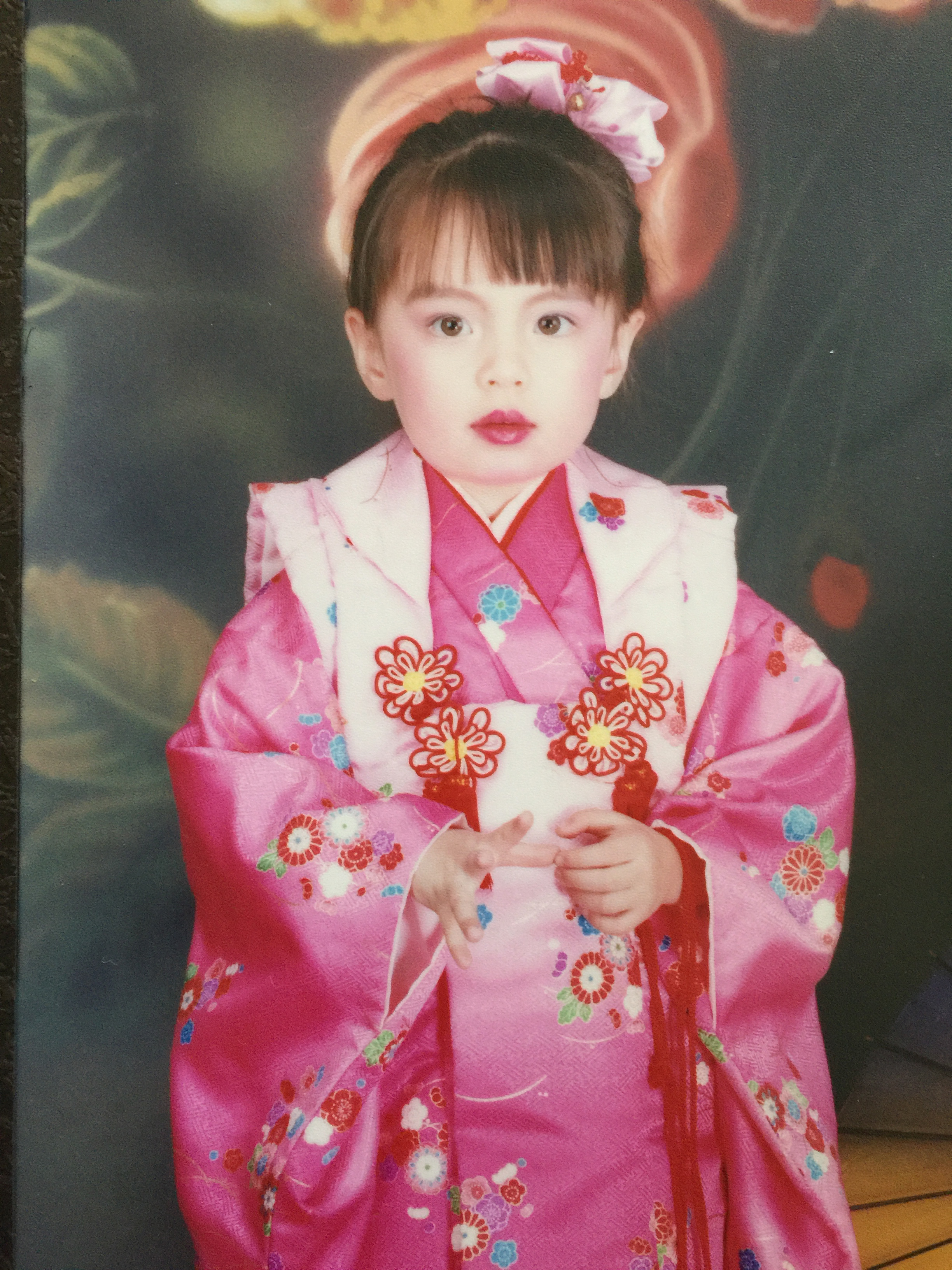 A family photo of Jaguar Jonze as a kid. Pictured: a young Taiwanese girl dressed in a traditional pink kimono.
