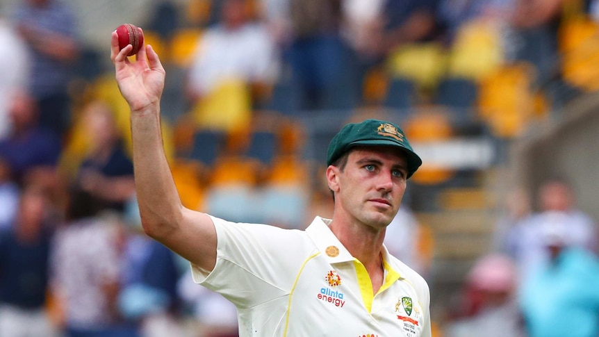 Australia's Pat Cummins gestures after taking five wickets during day one of the first Ashes